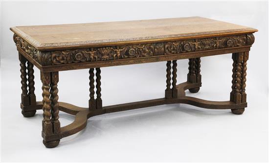 A 17th century style Flemish carved oak library table, W.6ft